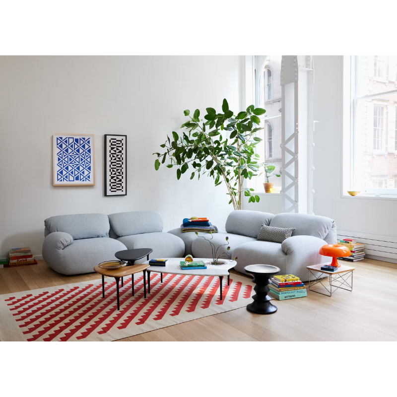 Three of the Cyclade Tables from Herman Miller within a lounge area.