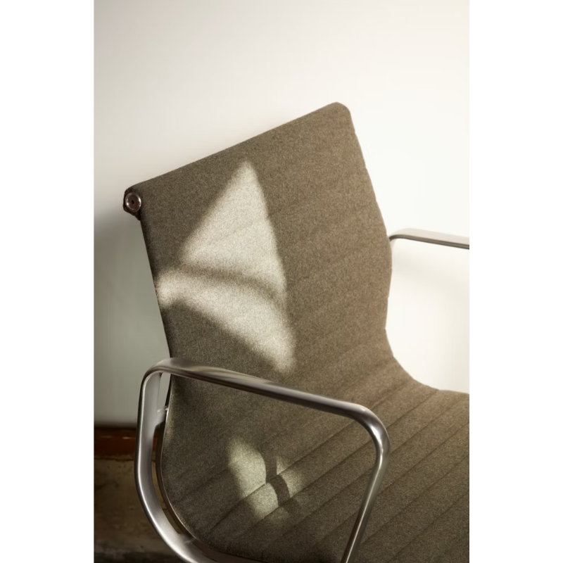 The Eames Aluminum Group Chair, Executive from Herman Miller in a close up shot.