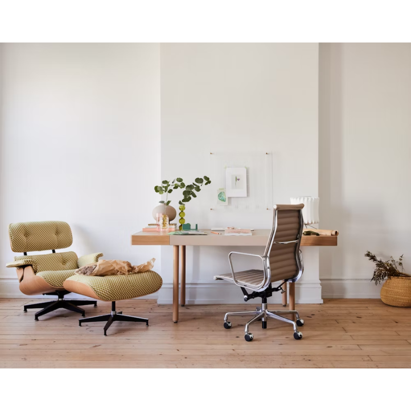 The Eames Aluminum Group Chair, Executive from Herman Miller in a living room.