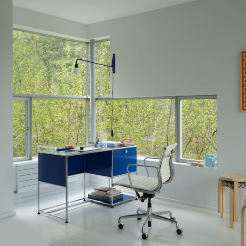 The Eames Aluminum Group Chair, Management from Herman Miller in a home.