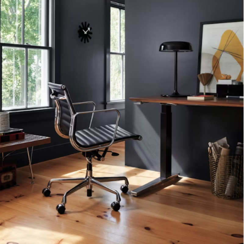 The Eames Aluminum Group Chair, Management from Herman Miller in a residential setting.
