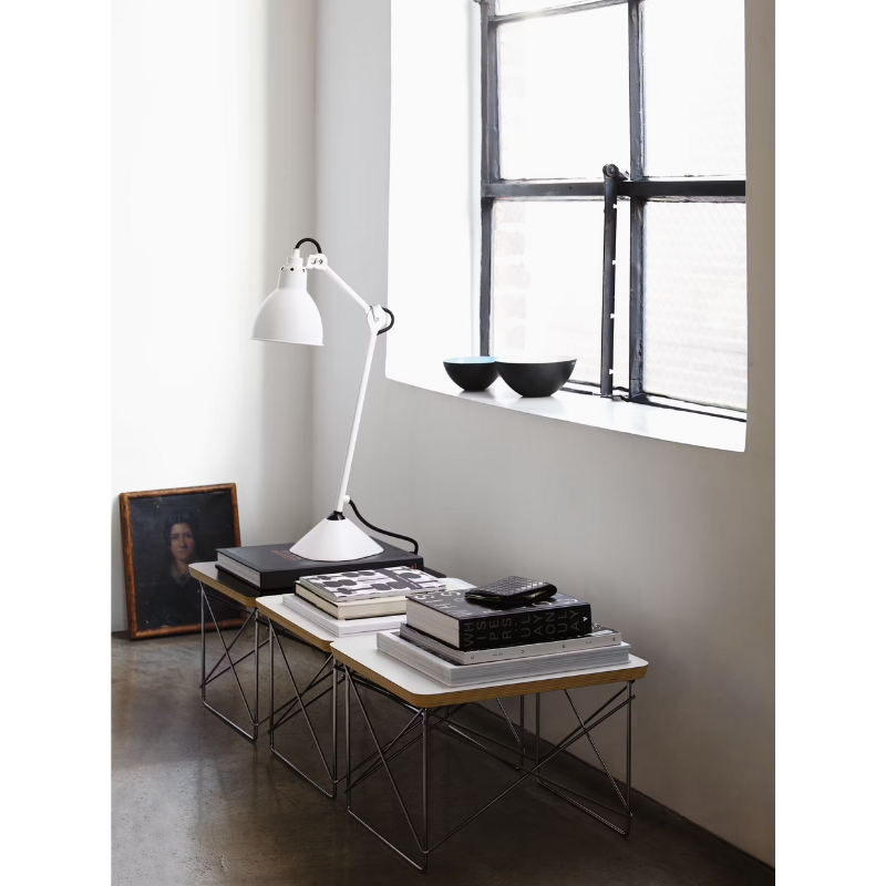 The Eames Wire Base Low Table from Herman Miller in a lounge. all-groups