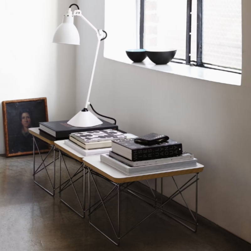 The Eames Wire Base Low Table from Herman Miller in a lounge. all-groups
