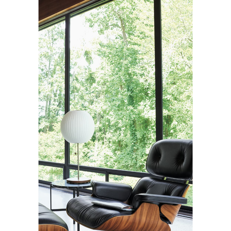 The Nelson Ball Lotus Table Lamp from Herman Miller in a living room.