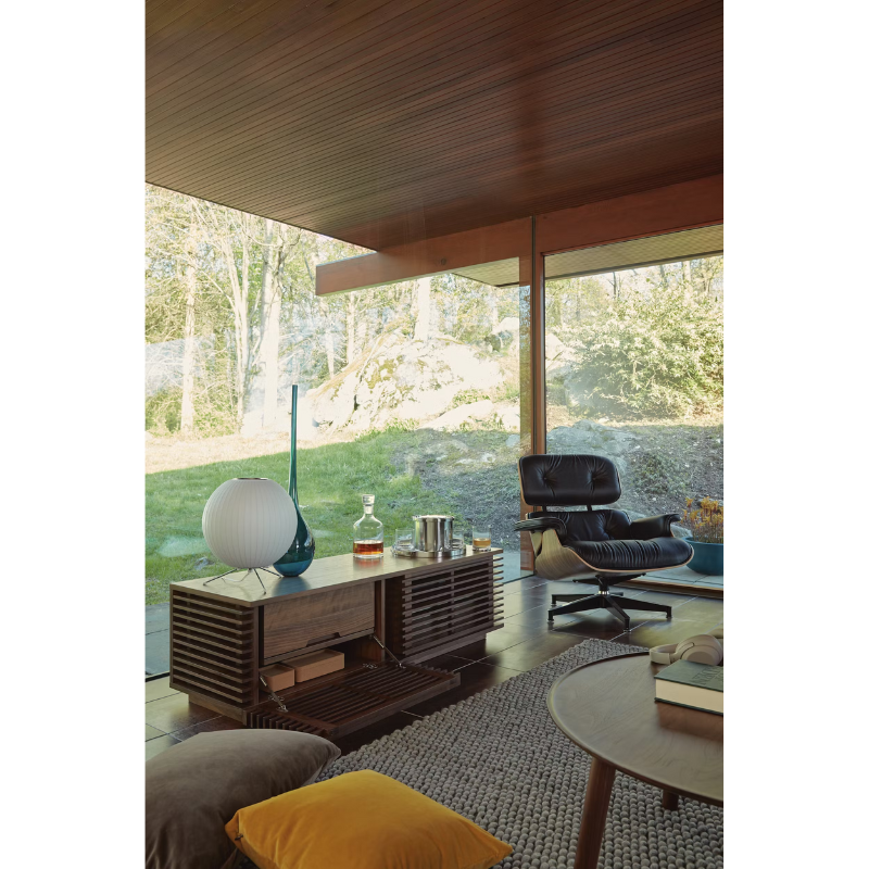 The Nelson Ball Tripod Table Lamp from Herman Miller in a living room lifestyle photograph.