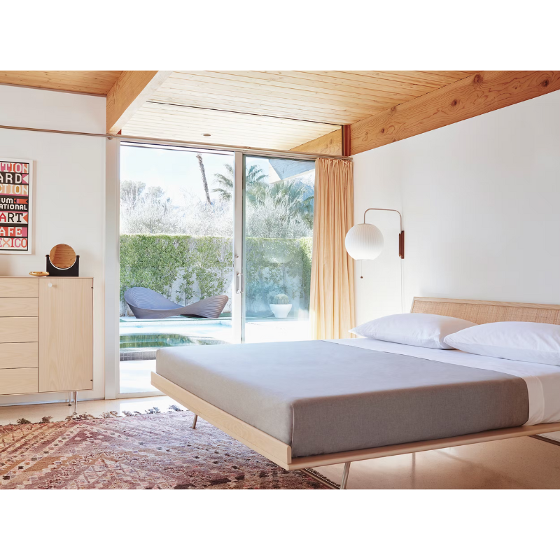 The Nelson Ball Wall Sconce from Herman Miller in a bedroom.