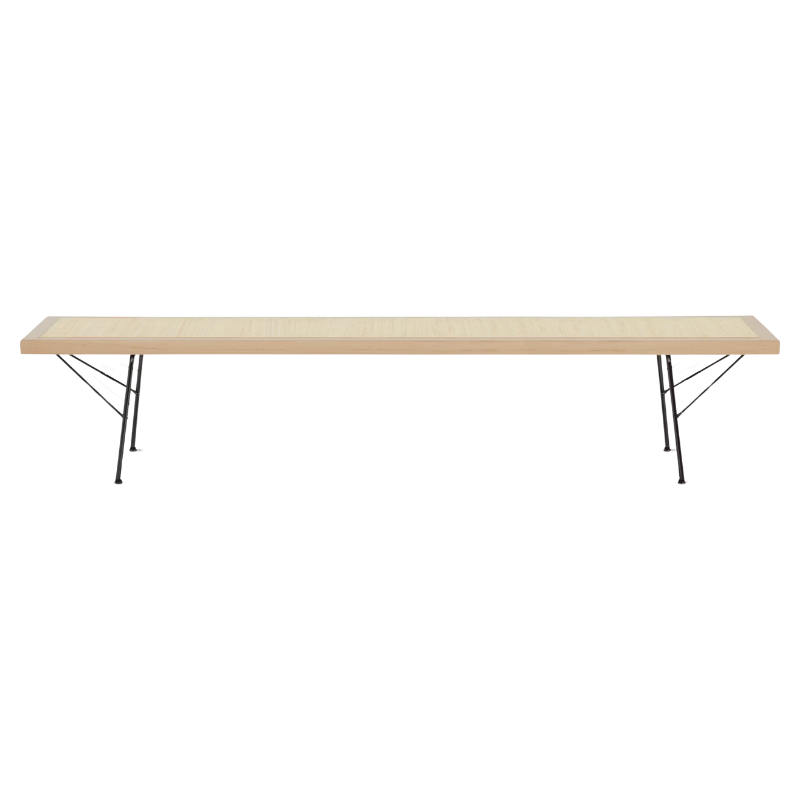 Offering a pleasing mix of materials, the richly textured cane is surrounded by a wood frame and stands on metal legs. Because the cane is taut but gives ever so slightly, this bench is ideally suited for use as a seat, table, or both.
