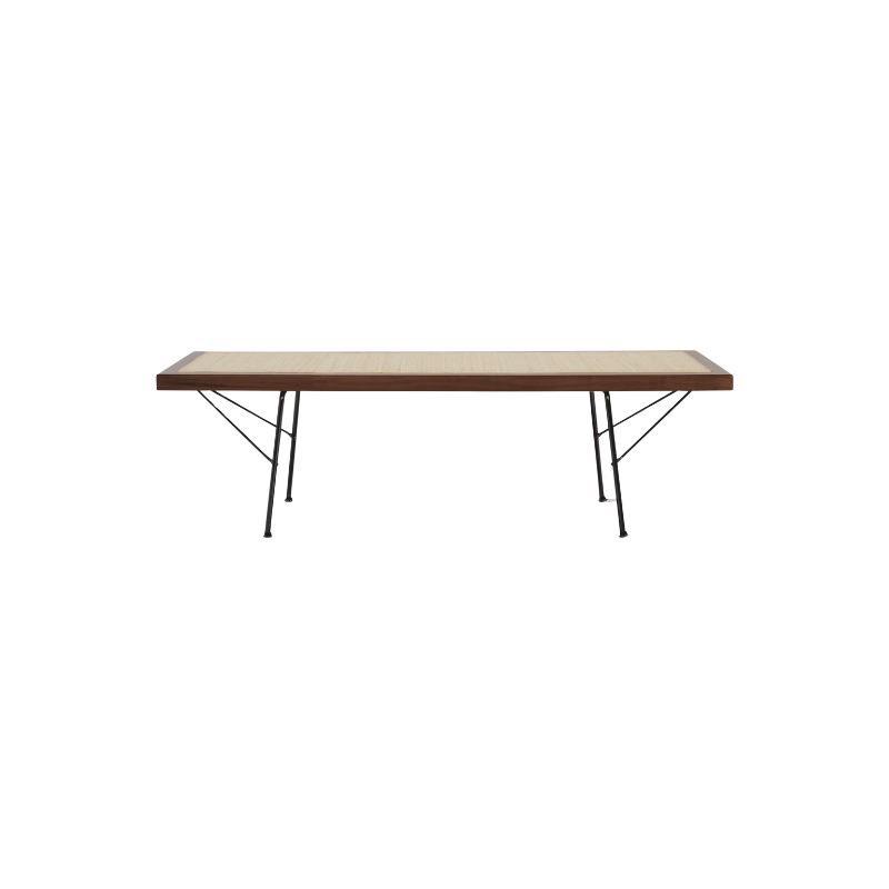 Offering a pleasing mix of materials, the richly textured cane is surrounded by a wood frame and stands on metal legs. Because the cane is taut but gives ever so slightly, this bench is ideally suited for use as a seat, table, or both.