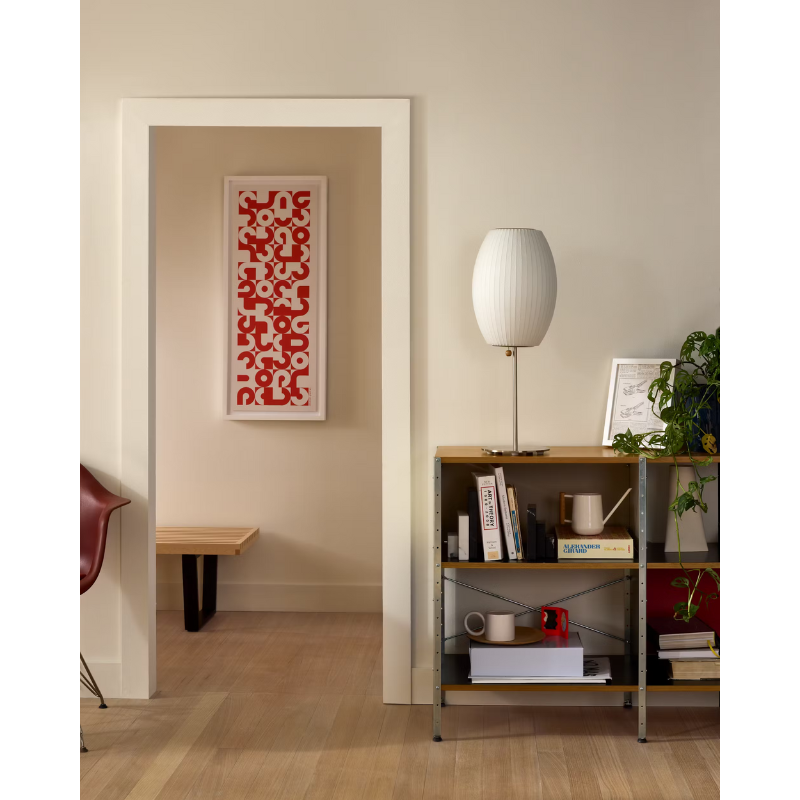 The Nelson Cigar Lotus Table Lamp from Herman Miller in a living room lifestyle photograph.