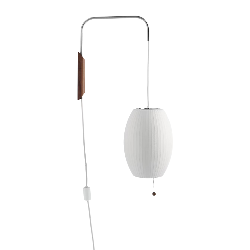 The Nelson Cigar Wall Sconce from Herman Miller in a photograph showing it is adjustable.