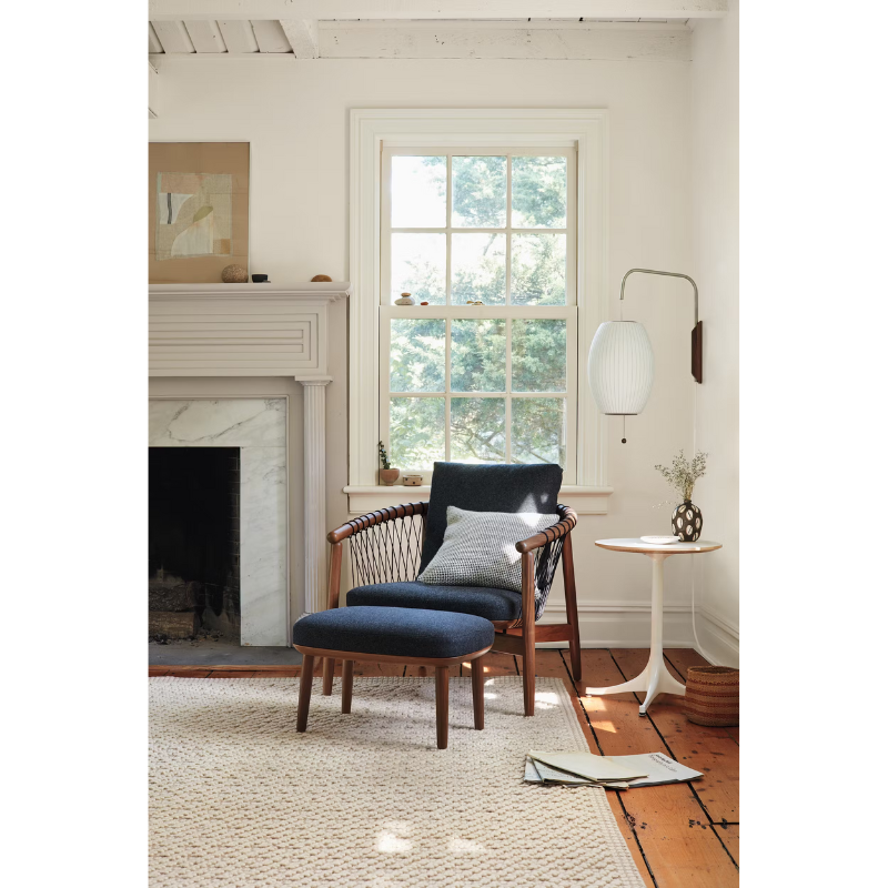 The Nelson Cigar Wall Sconce from Herman Miller in a living room.