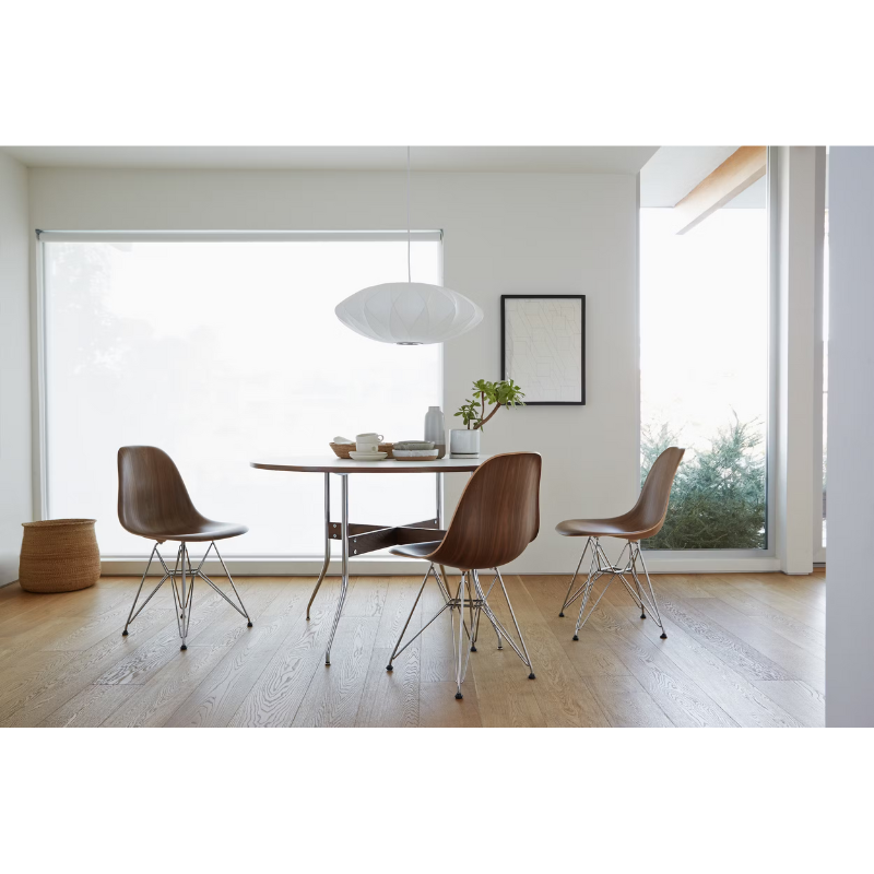 The Nelson Saucer Crisscross Bubble Pendant from Herman Miller in a living room.