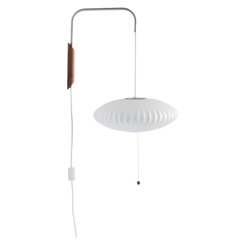 A photograph of the Nelson Saucer Wall Sconce from Herman Miller showing how the shade has an adjustable height.