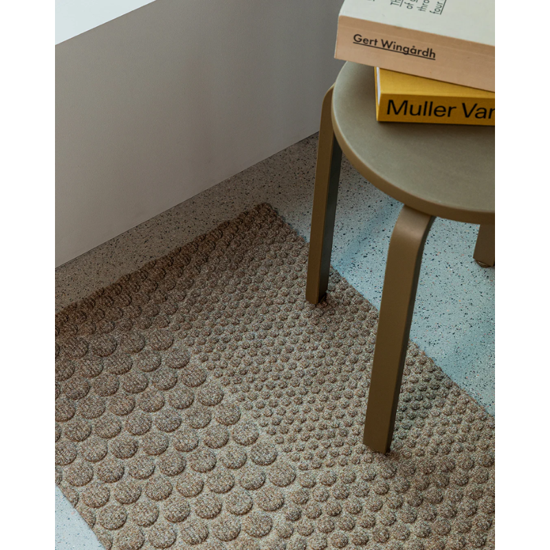 The Hex Doormat by Heymat in a living room.