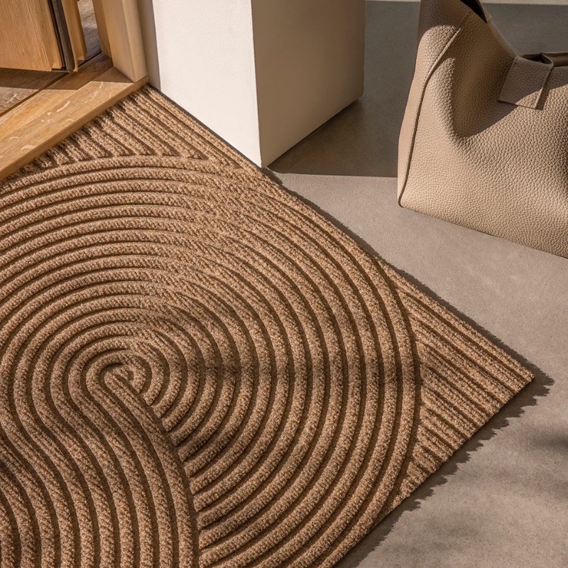 The Sand Doormat from Heymat in an entryway.