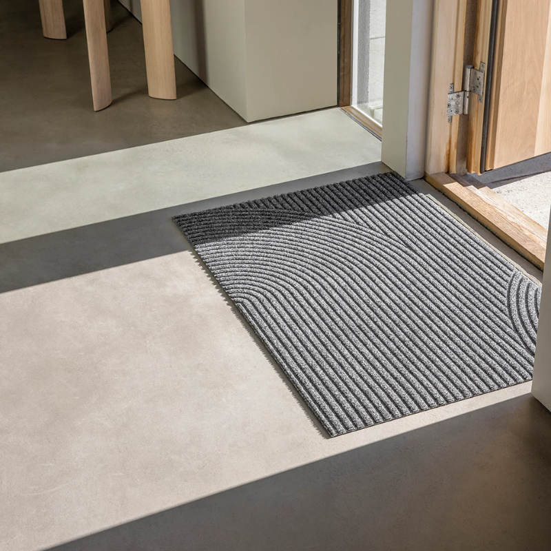 The Stein Doormat from Heymay in the small size beside a doorway.