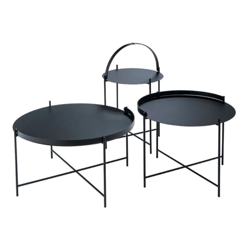 The EDGE tray table is a versatile piece of furniture that can be used both indoors and outdoors. It is made of powder-coated metal and comes in three different sizes. The half-ring shaped handle makes it easy to move the table between the living room and the garden, and when laid down it functions as a table edge making sure everything stays in place.