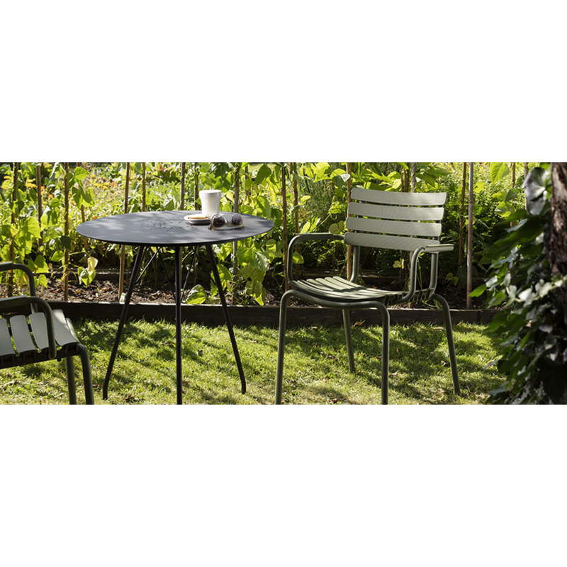 The ReCLIPS Dining Chairs come in four colors with the option of adding bamboo armrests. The combination of the aluminum frame with UV-protected plastic lamellas ensures minimal maintenance, making these chairs an ideal choice for hassle-free use. Like all good designs, these dining chairs are not just beautiful but practical as well. They are stackable, facilitating easy storage and space optimization.