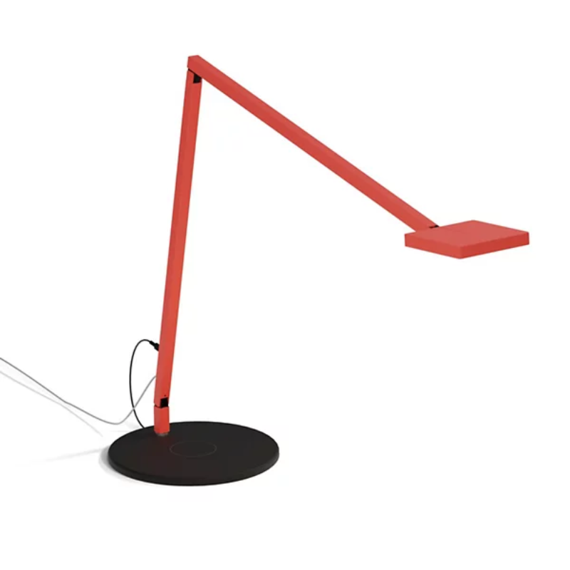 The Focaccia Desk Lamp from Koncept with the wireless charging base in matte fire red.