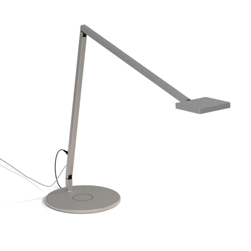 The Focaccia Desk Lamp from Koncept with the wireless charging base in silver.