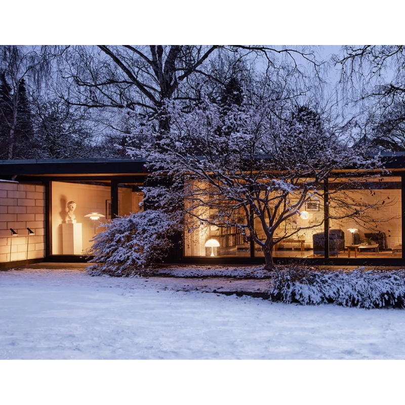 The AJ Garden Bollard from Louis Poulsen in a lifestyle shot.