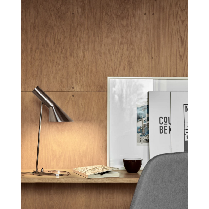 The AJ Mini Table Lamp from Louis Poulsen in an art studio.