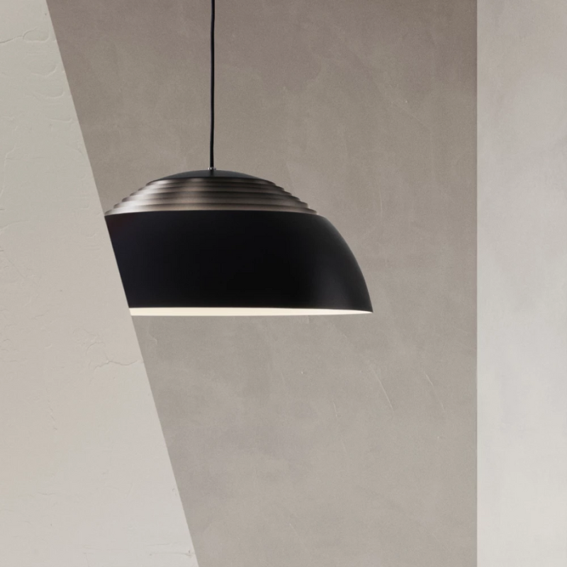 The AJ Royal from Louis Poulsen in a lounge.