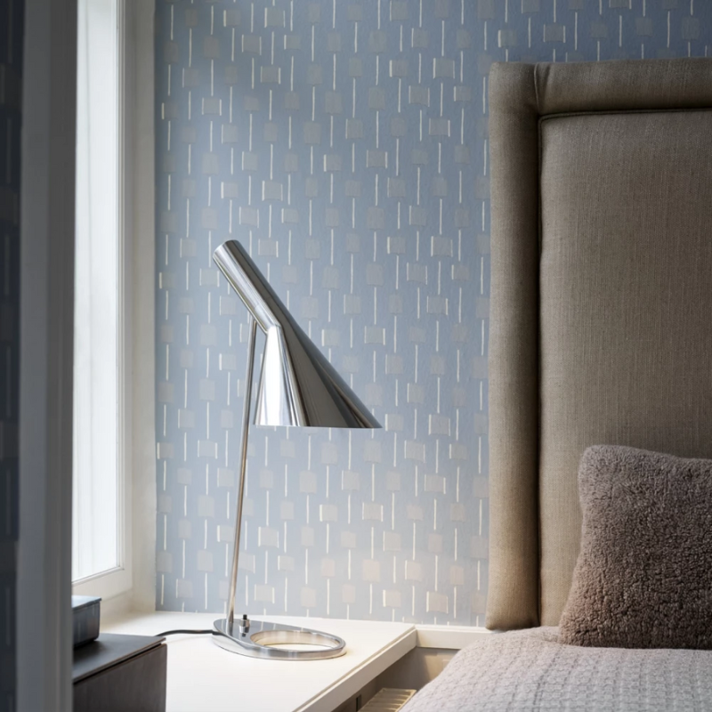 The AJ Table Lamp from Louis Poulsen in a bedroom.