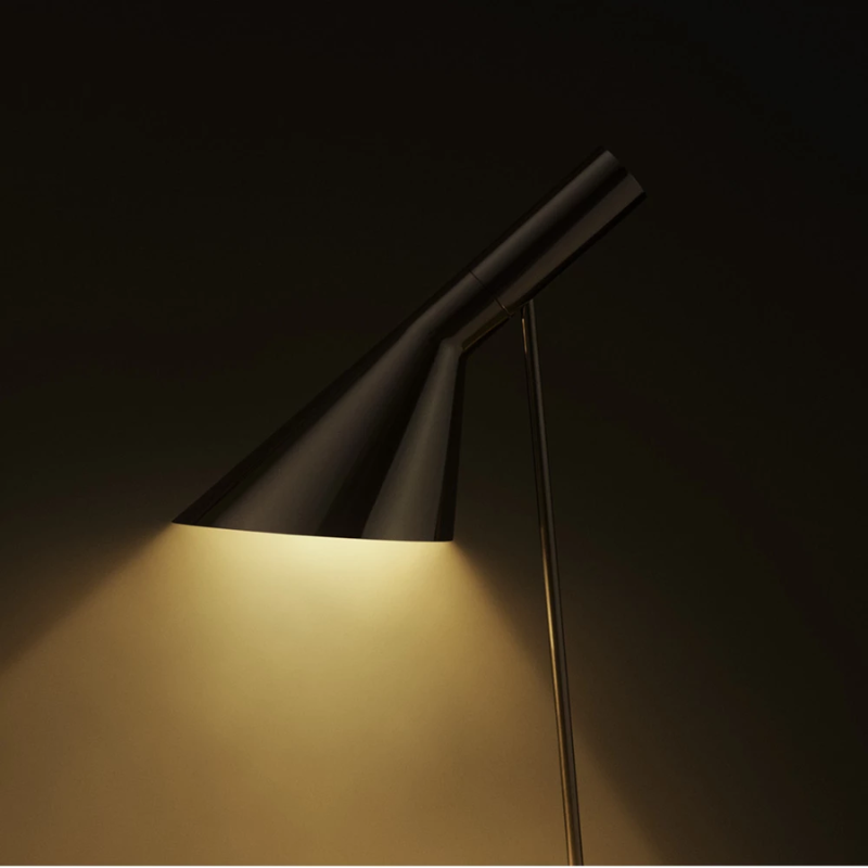 The AJ Table Lamp from Louis Poulsen in a close up lifestyle photograph.