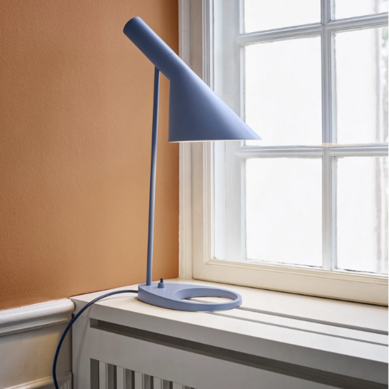 The AJ Table Lamp from Louis Poulsen in a family space.