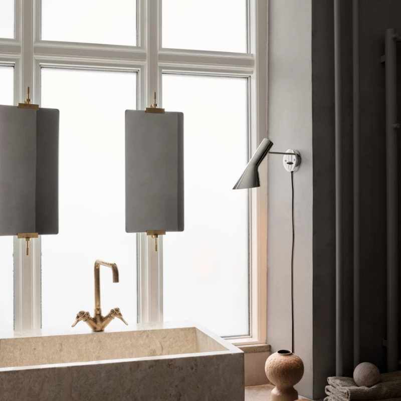 The AJ Wall from Louis Poulsen within a bathroom.