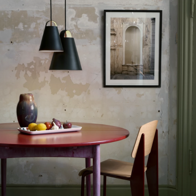 The Above from Louis Poulsen in a dining room.