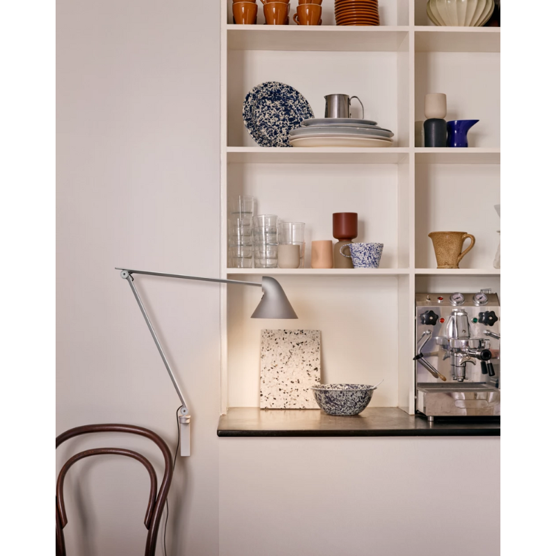 The NJP Wall from Louis Poulsen in a lounge.