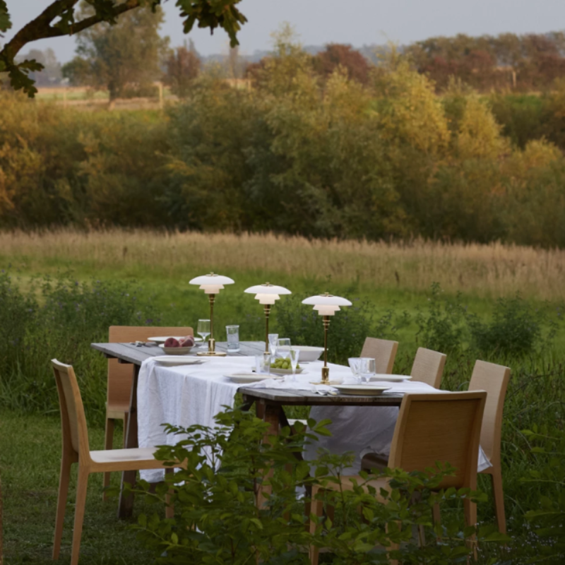 The PH 2/1 Portable from Louis Poulsen in an outdoor dining space.