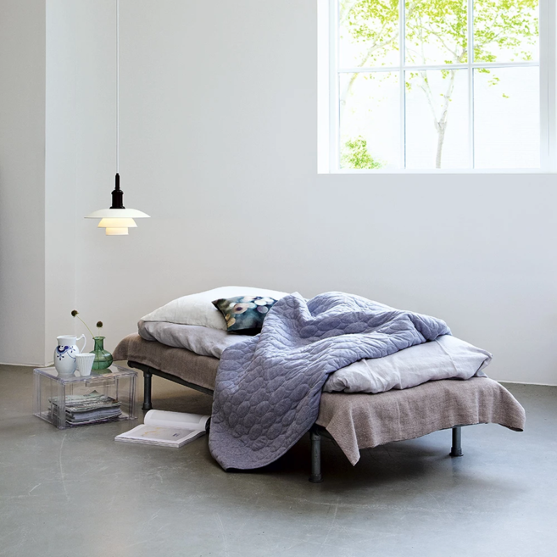 The PH 3½-3 Pendant Light from Louis Poulsen in a bedroom.