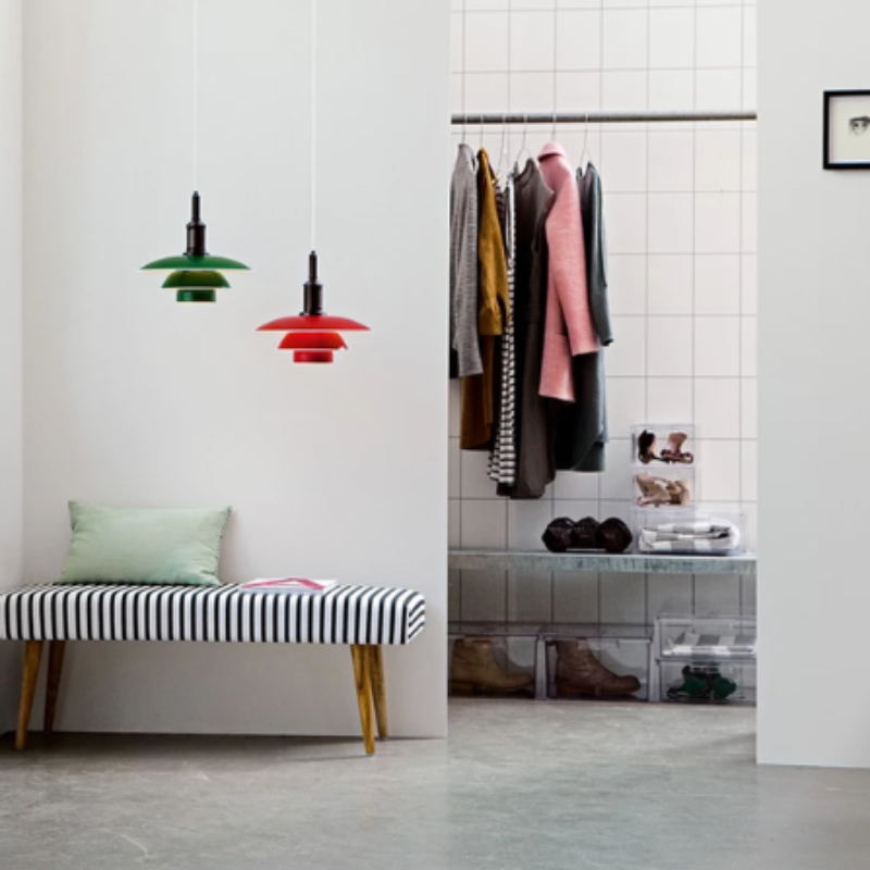 The PH 3½-3 Pendant Light from Louis Poulsen in a lounge lifestyle phtoograph.