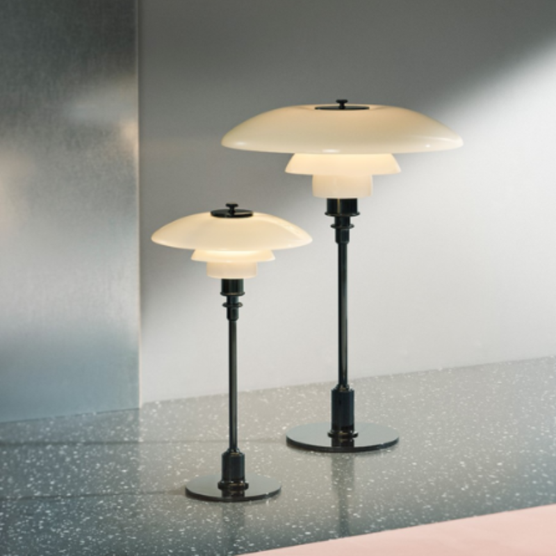 The PH 3½-2½ Glass Table Lamp from Louis Poulsen in a lighting collection image.