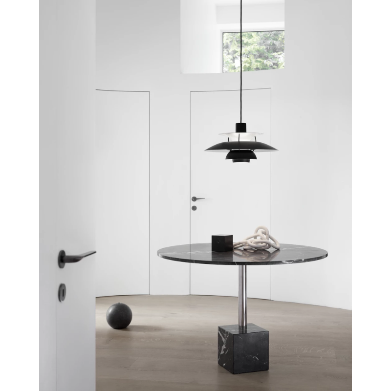 The PH 5 from Louis Poulsen in a lounge lifestyle photograph.