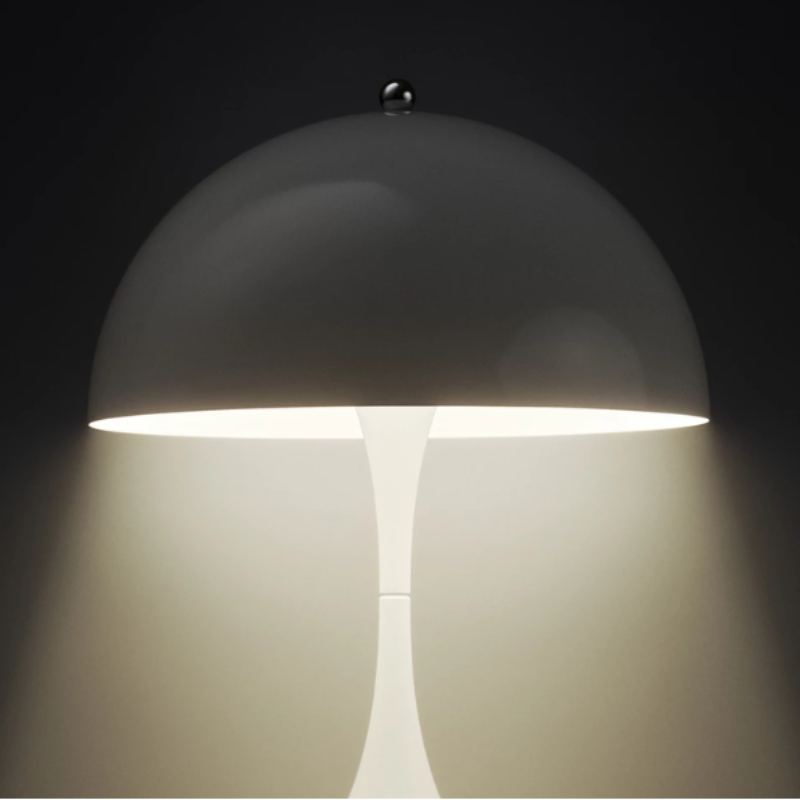 The Panthella 160 Portable from Louis Poulsen in metal with the light turned on.