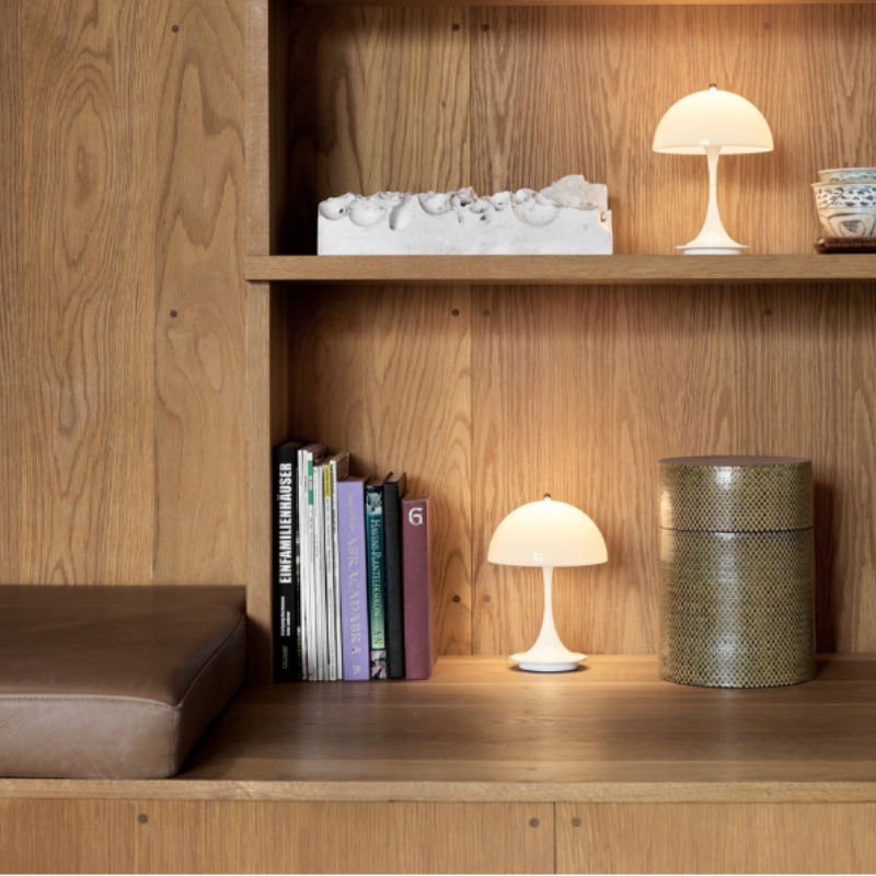 The Panthella 160 Portable from Louis Poulsen in a workspace.