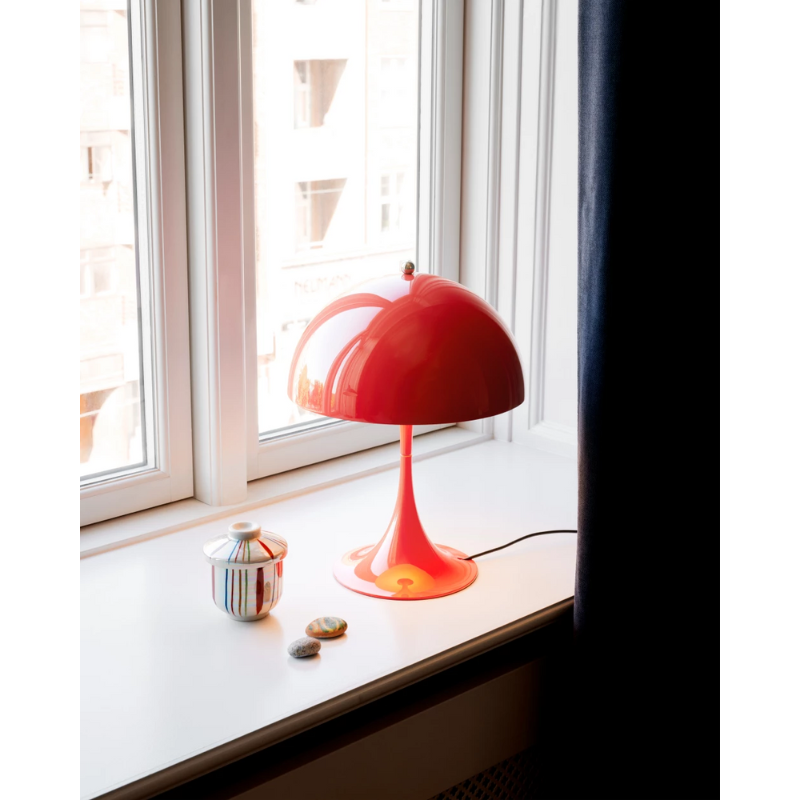 The Panthella 250 Table Lamp from Louis Poulsen in a den.