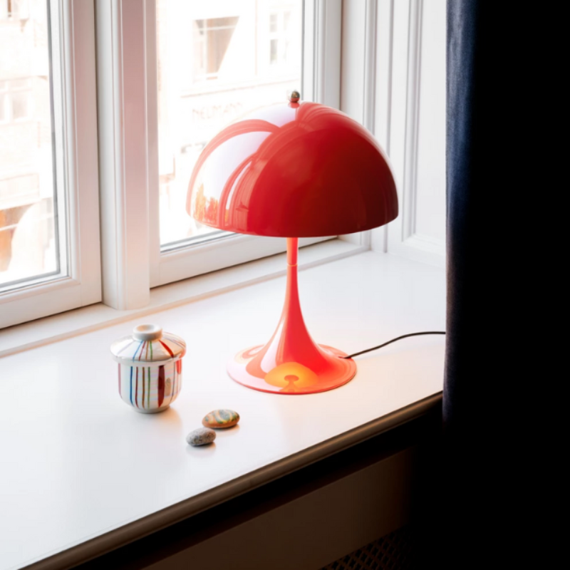 The Panthella 250 Table Lamp from Louis Poulsen in a den.