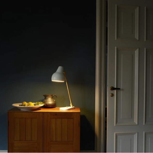 The VL38 Table from Louis Poulsen in a bedroom.