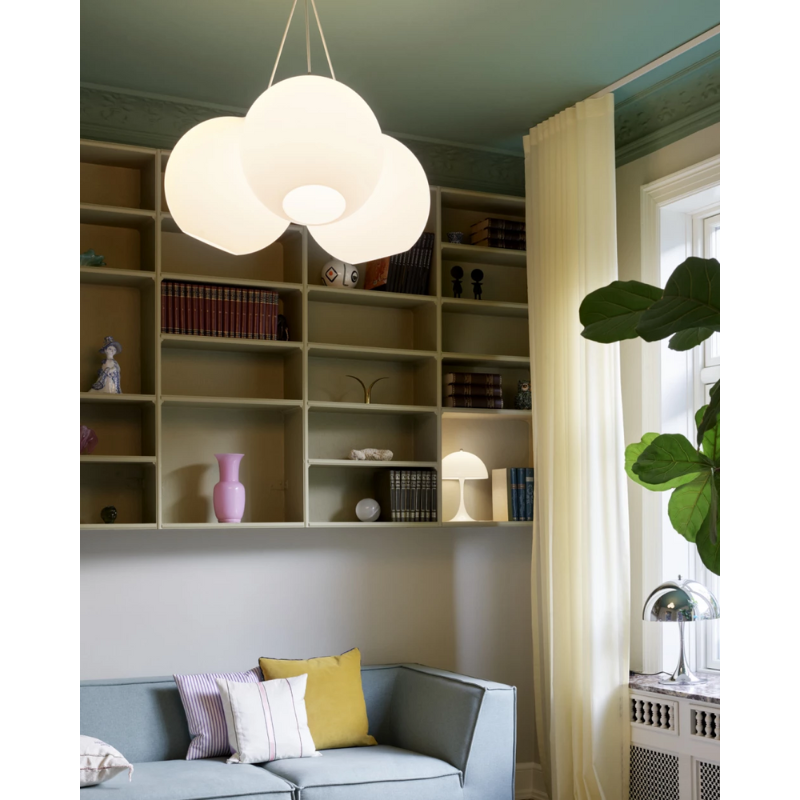 The Wohlert from Louis Poulsen in a lounge lifestyle photograph.