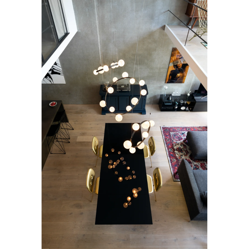 Hubble Bubble, designed by Marcel Wanders, is an airy and joyful suspension lamp. Available in two sizes, with either 7 or 11 glass LED bubbles in oil-iridescent or frosted versions. Hubble Bubble can be hung both horizontally and vertically and is powered through Electrosandwich® by Marcel Wanders. Hubble Bubble is the cheery statement piece in your home that can hang from any angle.