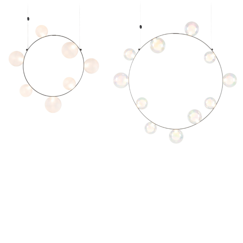 Hubble Bubble, designed by Marcel Wanders, is an airy and joyful suspension lamp. Available in two sizes, with either 7 or 11 glass LED bubbles in oil-iridescent or frosted versions. Hubble Bubble can be hung both horizontally and vertically and is powered through Electrosandwich® by Marcel Wanders. Hubble Bubble is the cheery statement piece in your home that can hang from any angle.