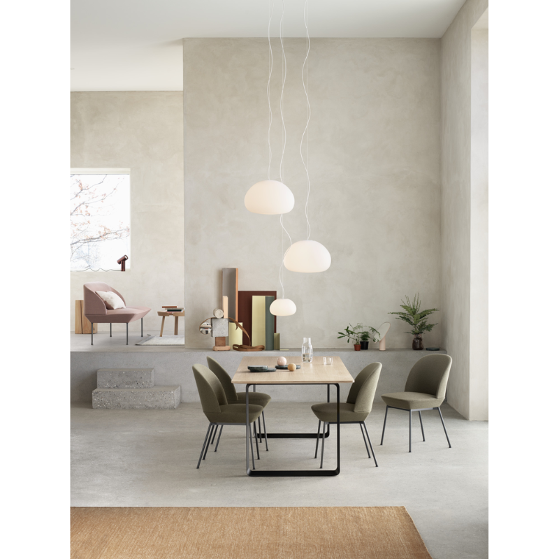 Three Fluid Pendant Lamps from Muuto in a dining room.