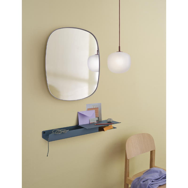 The Rime Pendant Lamp from Muuto in a bedroom.