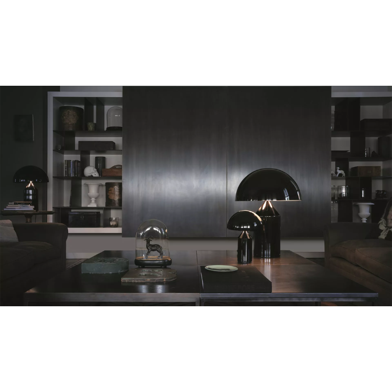 The Atollo Metal Table Lamp from Oluce in a living room.