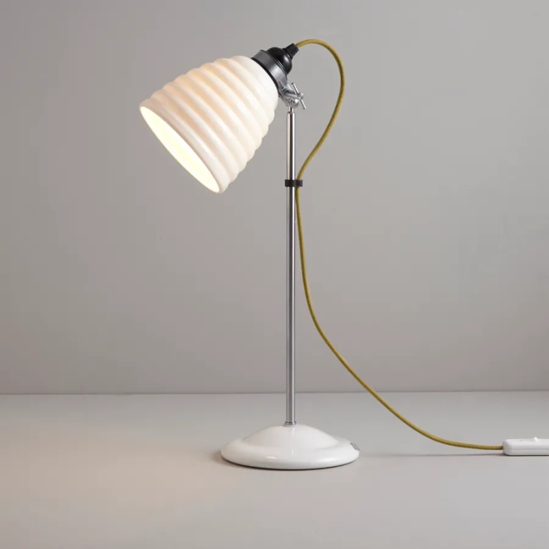 The Hector Bibendum, designed by Sir Terence Conran to celebrate Original BTC's 21st birthday and the Michelin building's centenary, is a fresh take on the classic Hector light. With a white, layered shade and colorful cotton-braided flex, this is a stylish light for the home.